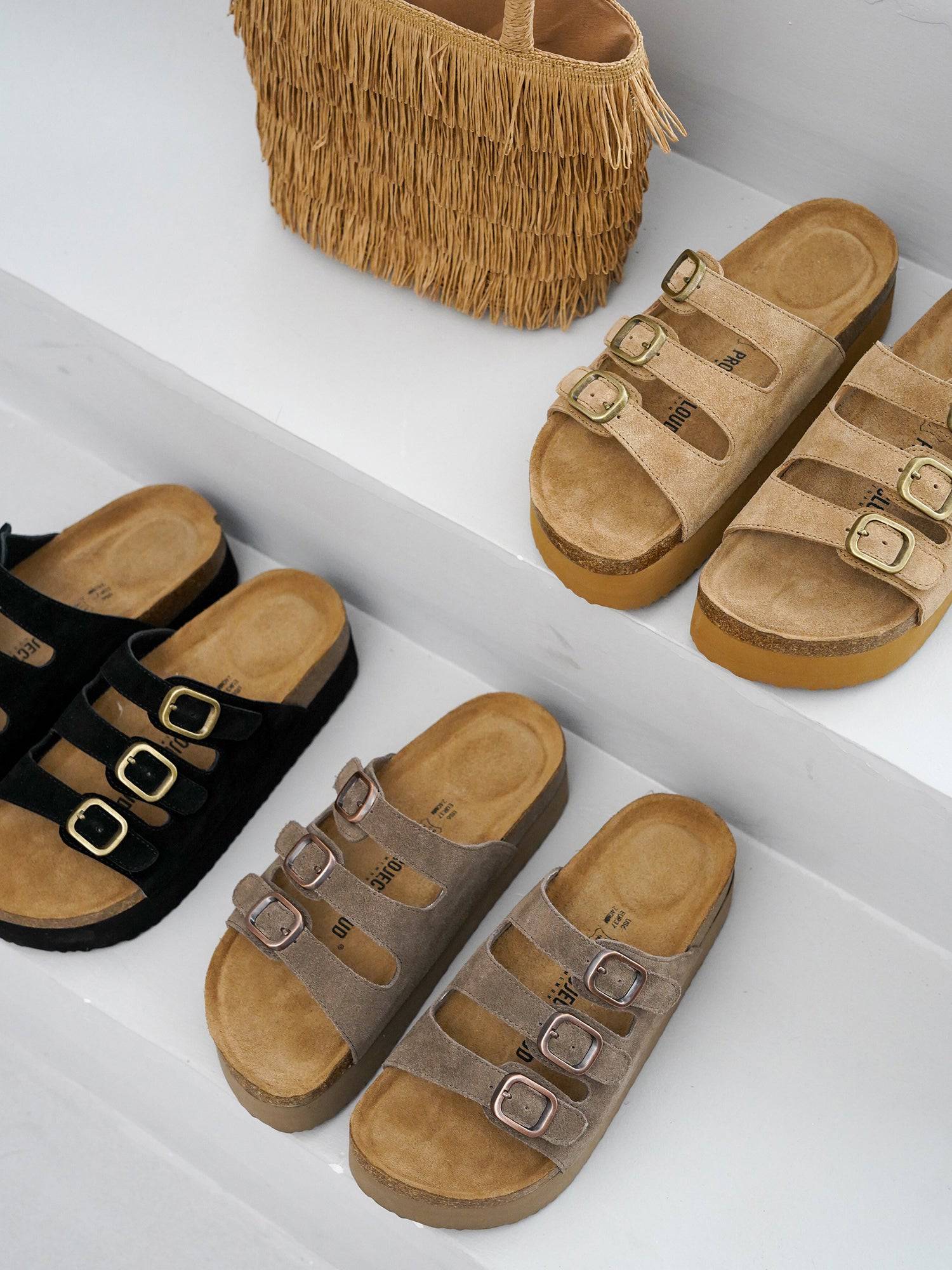 Project Cloud Dyan Platform Sandals display in tan, black and grey suede with three buckle straps.