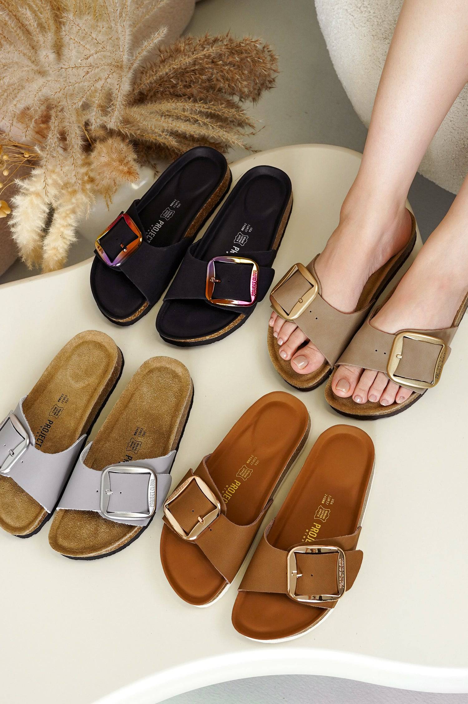 Project Cloud sandals. Leather upper, suede insole, cork footbed. Stylish buckles for summer comfort.