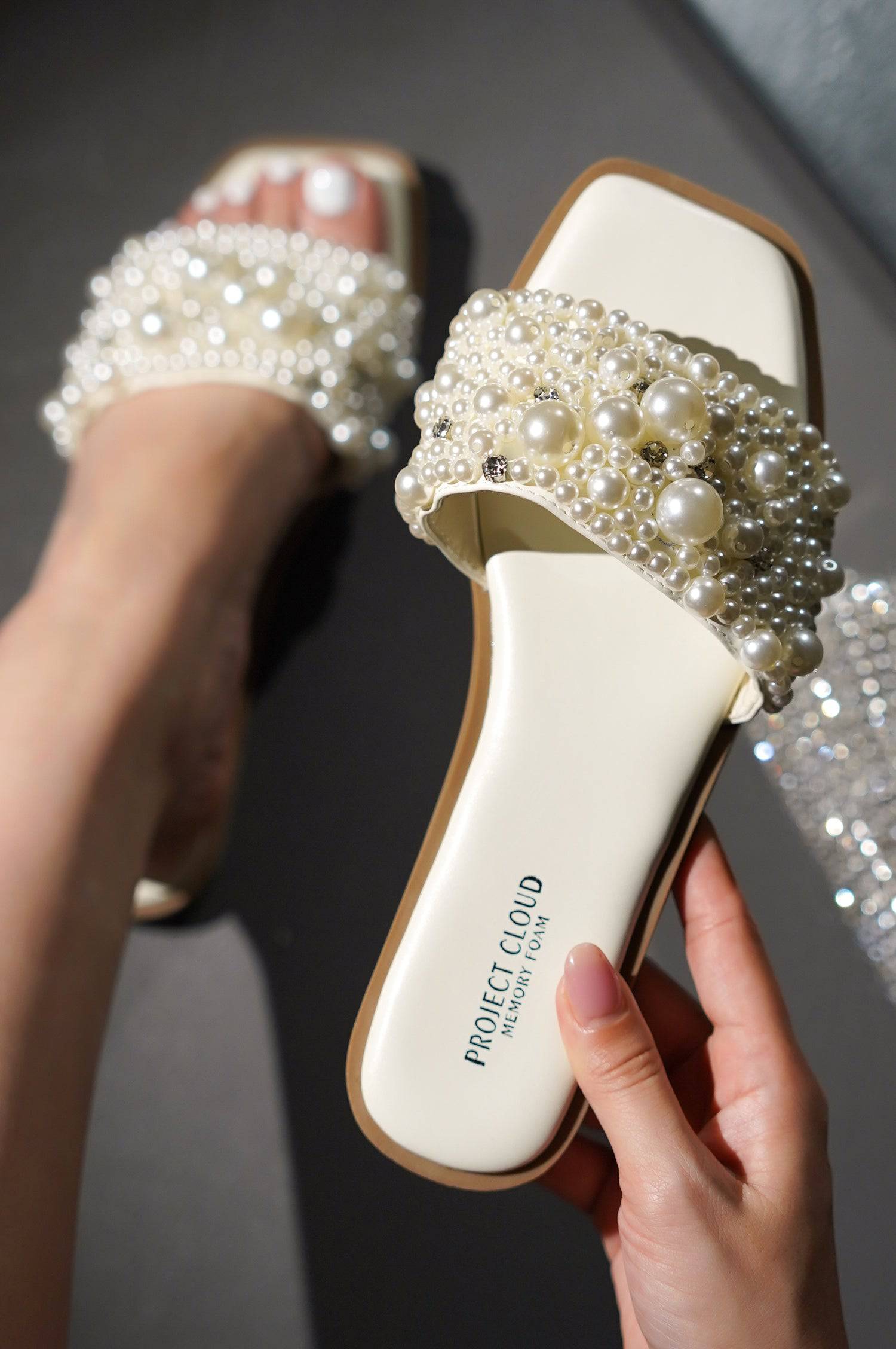 Project Cloud Rosemary Pearl Sandals. White slip-on flats with pearl embellishments, memory foam, and vegan leather.
