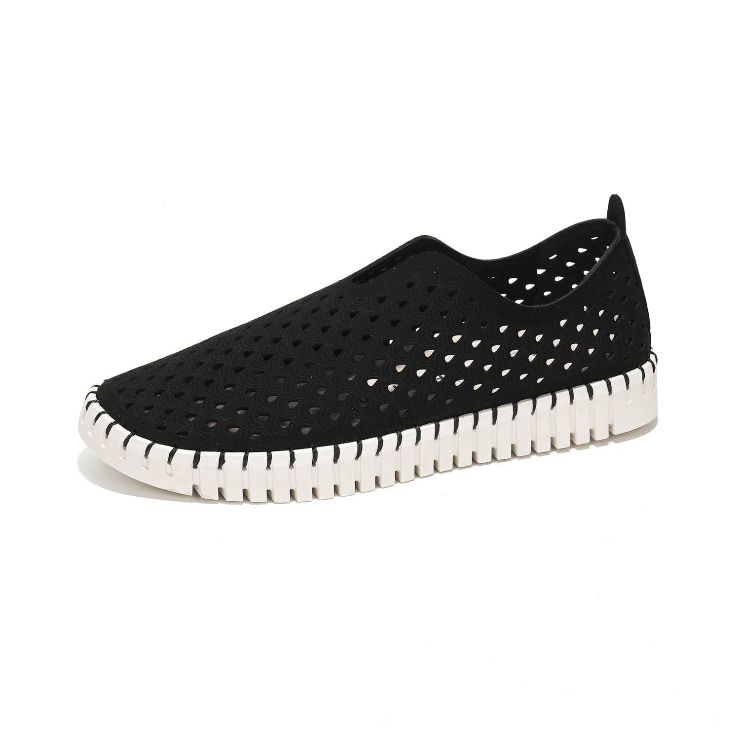 Black women's Lily loafers with laser-cut design, white sole, memory foam insole, perfect travel shoes.