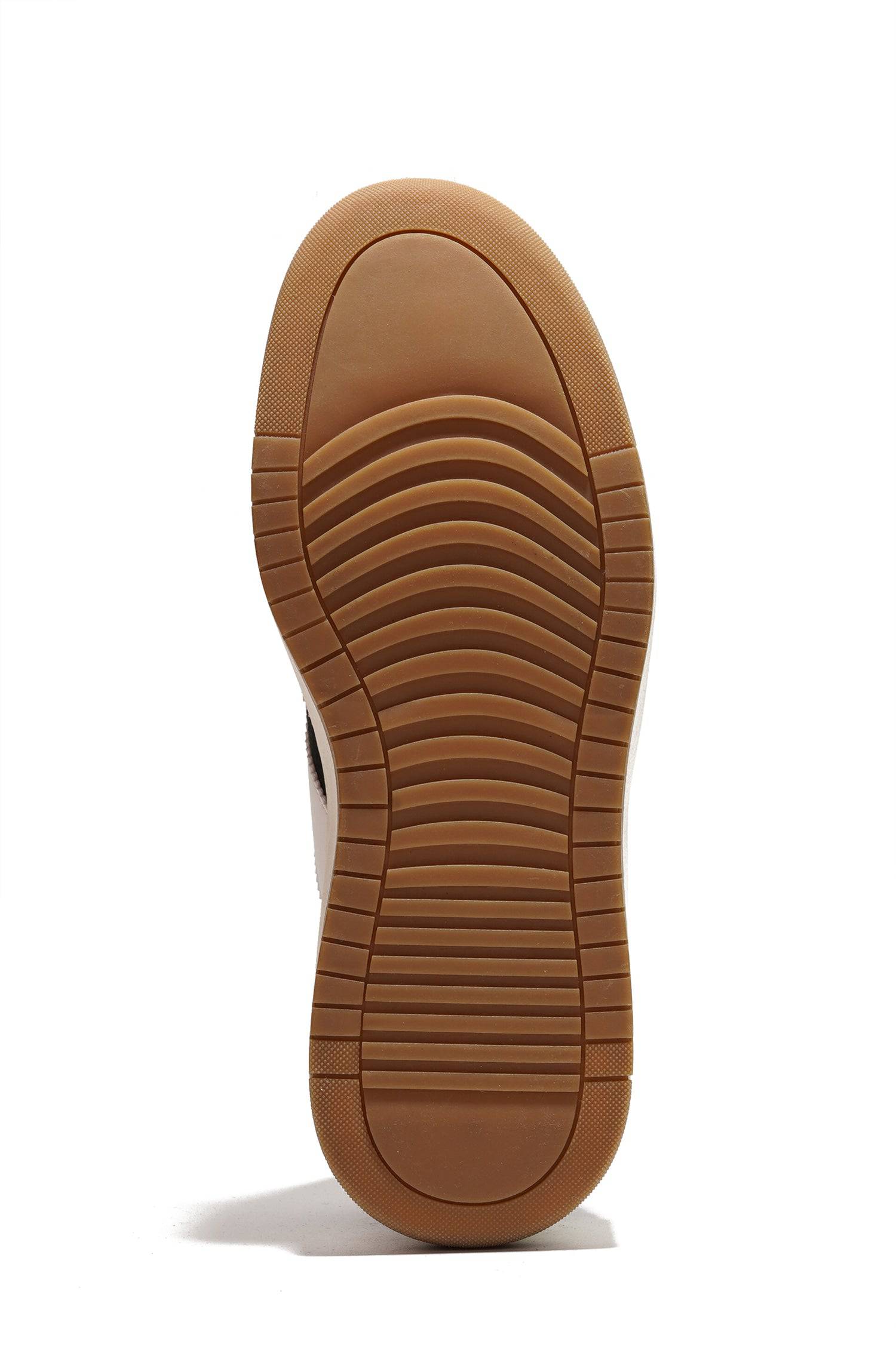 Nita sneaker's brown rubber outsole, offering non-slip grip and durability, enhancing women's comfort and daily wear.