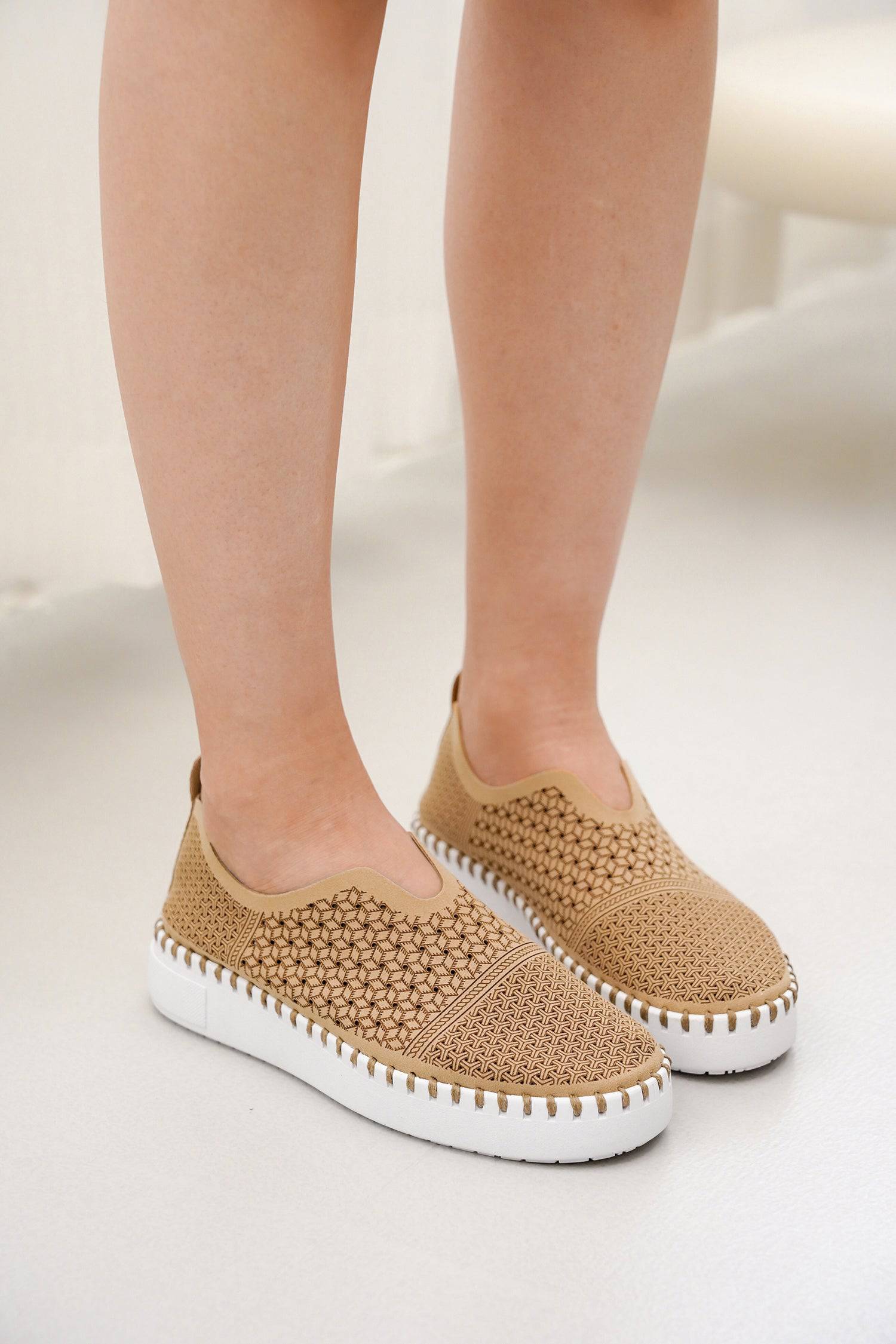 Aster Women's Tan Slip-on Sneakers with breathable knit upper and white sole.