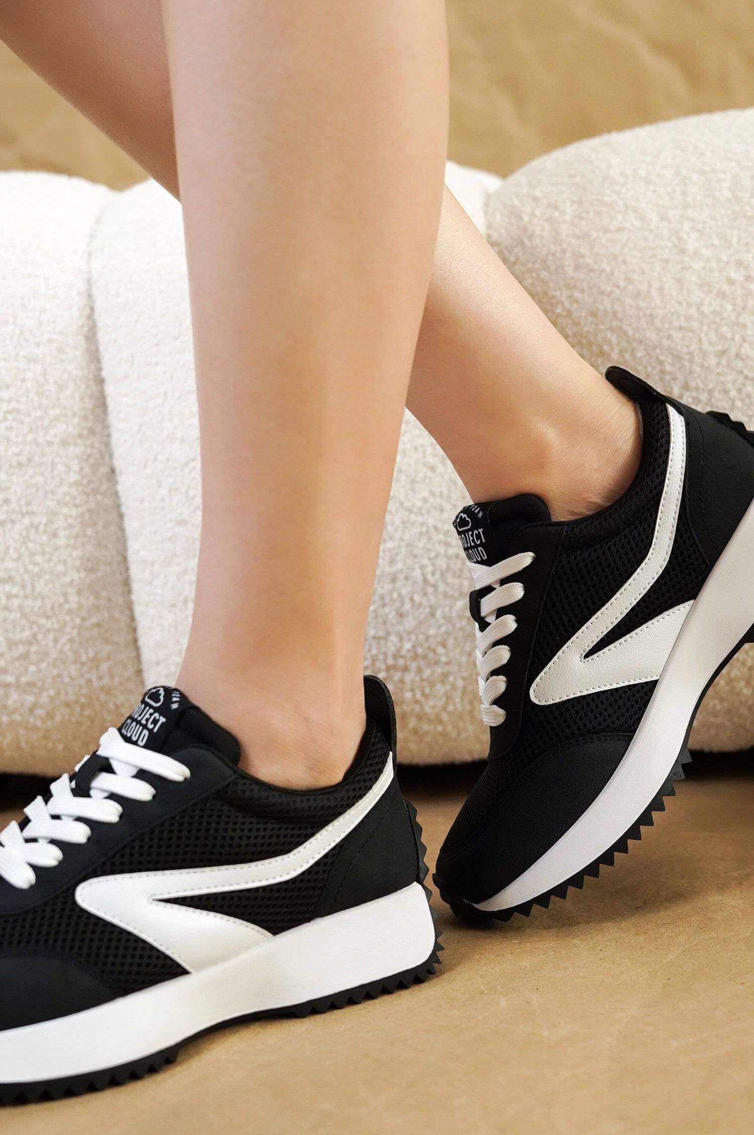 Balinda women's black sneakers with Project Cloud logo, white accents, and lace-up closure.