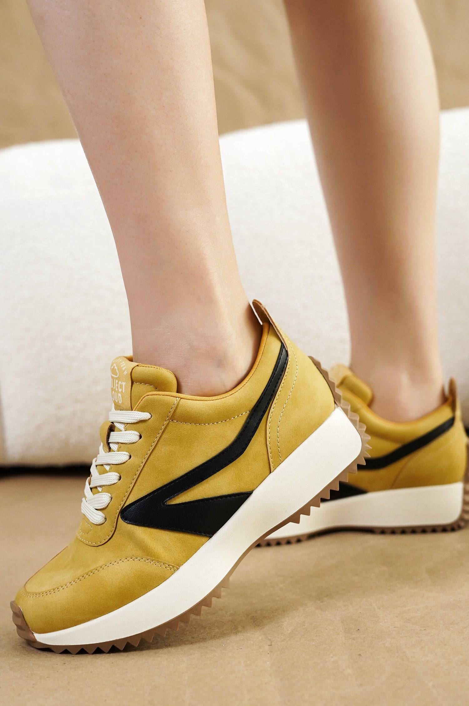 Balinda women's mustard yellow sneakers with Project Cloud logo, black accents, lace-up closure, and non-slip sole.