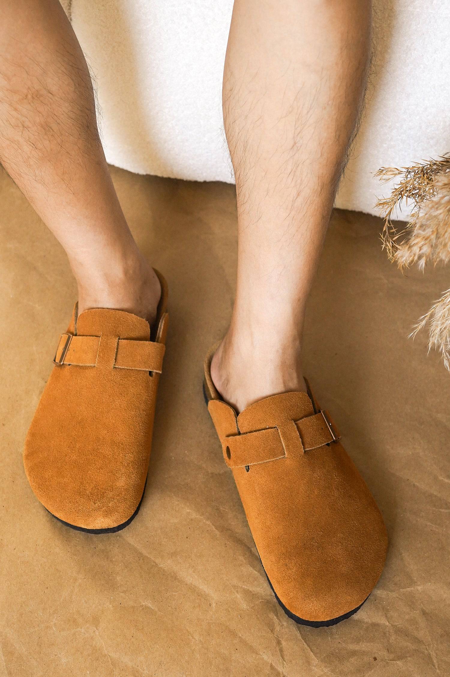 Chestnut suede Brooklyn clogs for men, showcasing comfort and style with buckle detail and cork footbed.