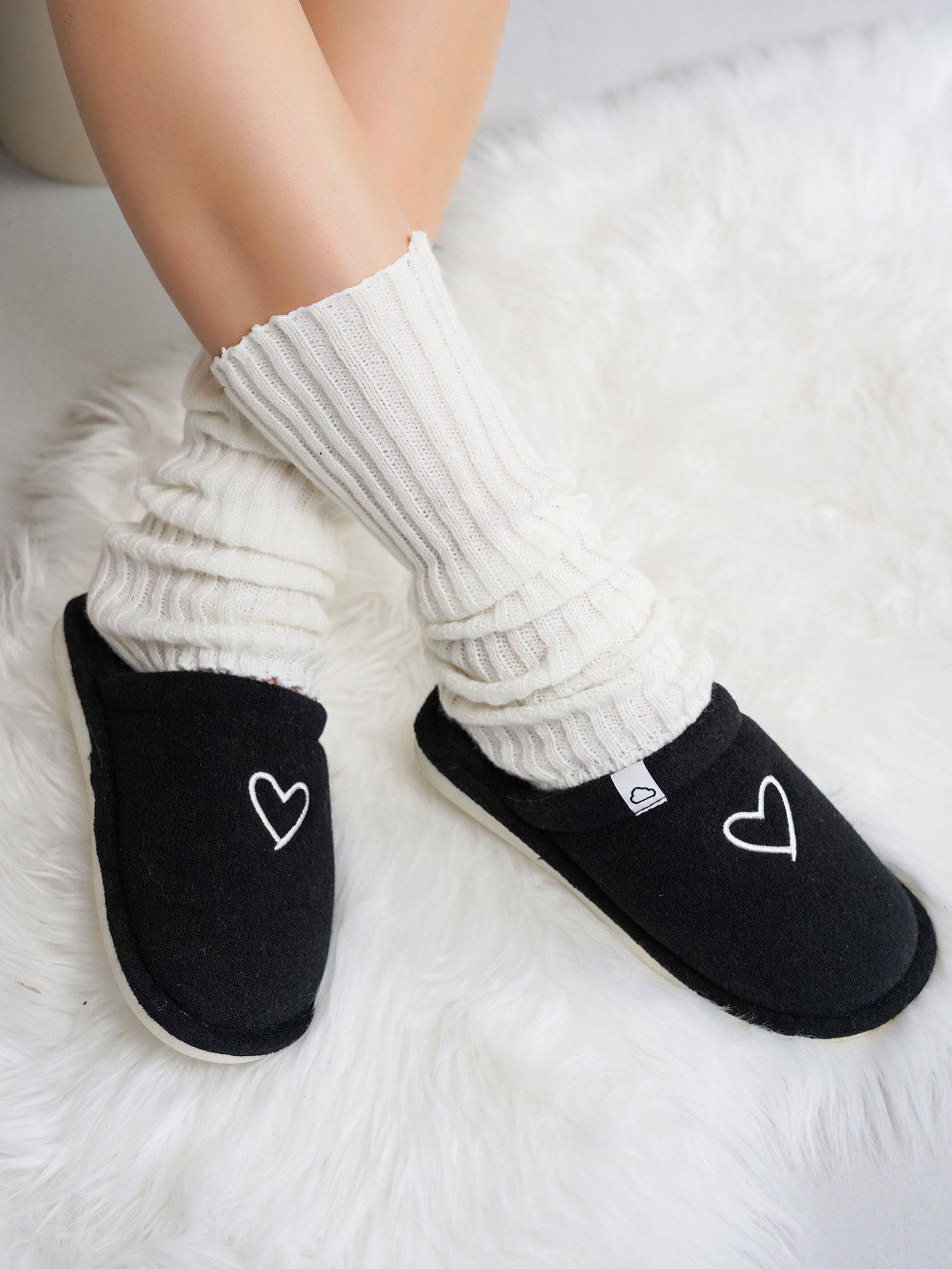 Project Cloud Casa black memory foam slippers with heart detail. Non-slip sole, cozy and stylish women's footwear.