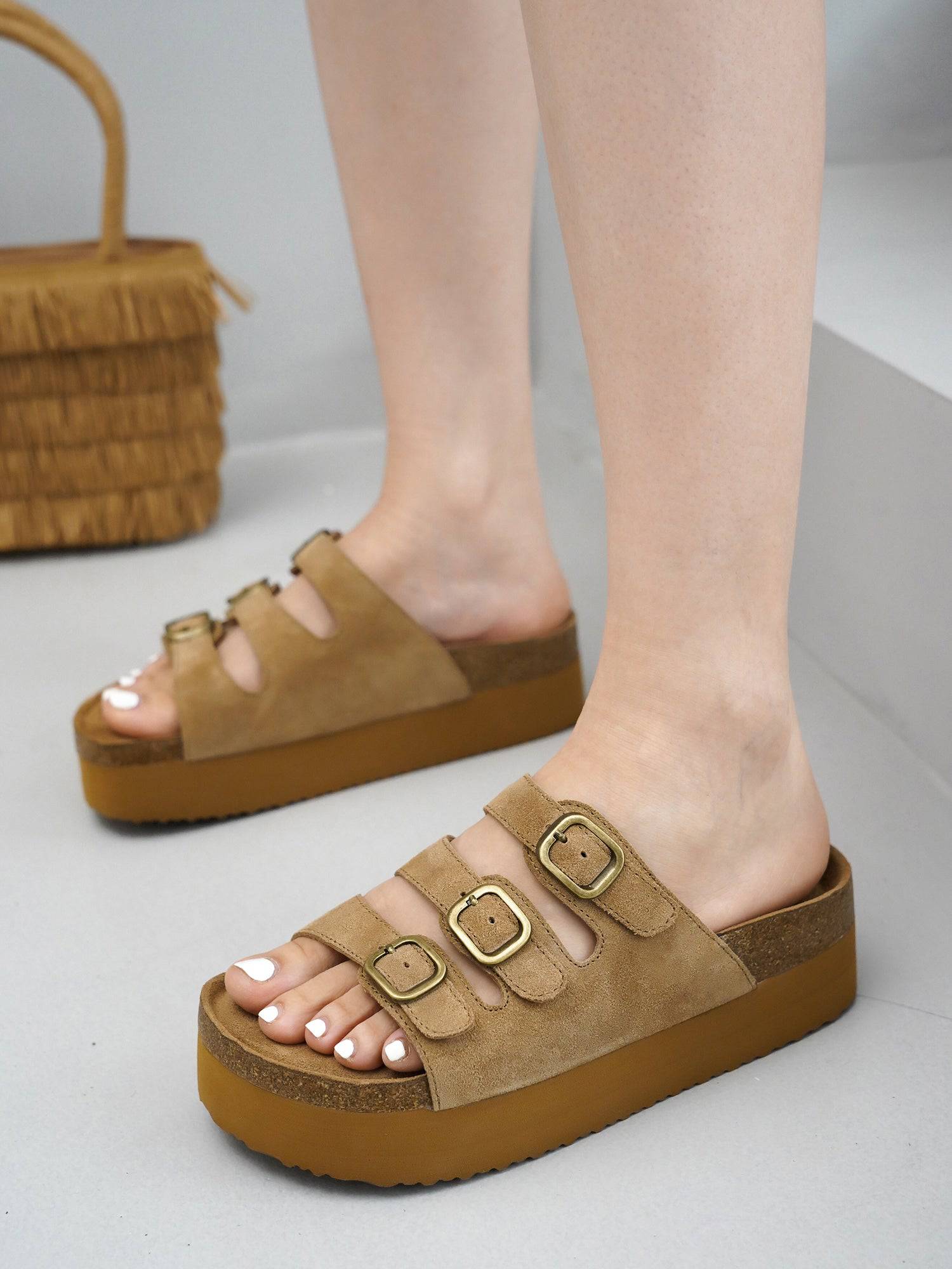 Project Cloud Dyan suede platform sandals in tan with adjustable buckle straps and cork footbed.