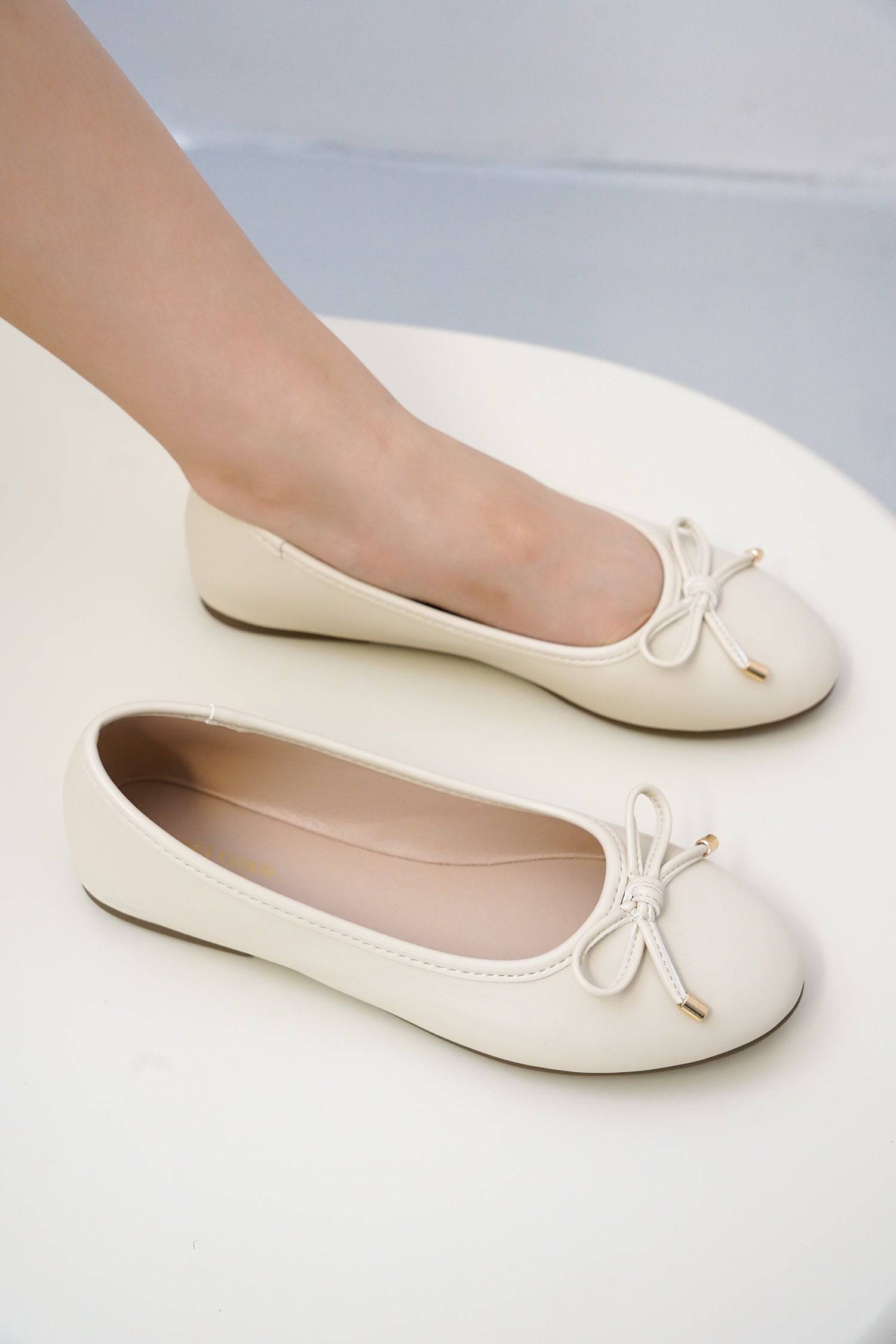 Cream Project Cloud ballet flats with bow detail and ProjectPlush insole for comfort.