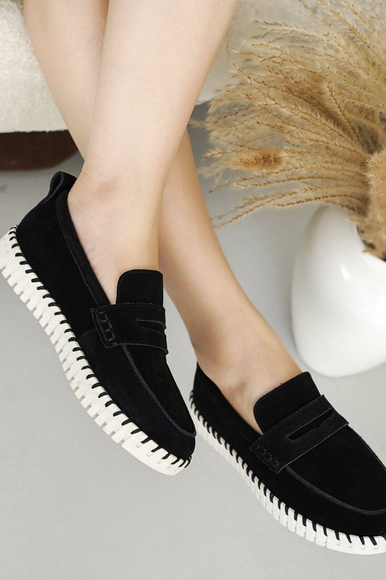 Black suede Filide loafers for women with white sole. Featuring memory foam insole, and non-slip sole for comfort.
