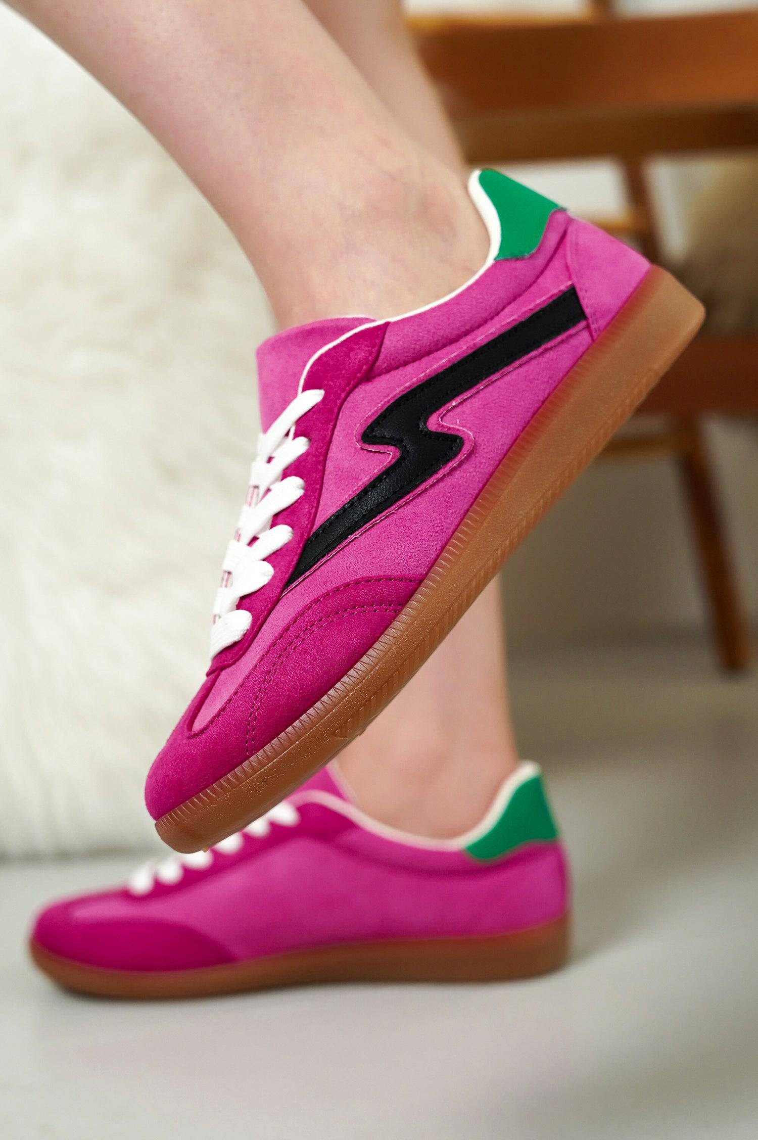 Project Cloud Irita pink sneakers with black lightning bolt detail. Women's suede lace-up shoes with brown sole.