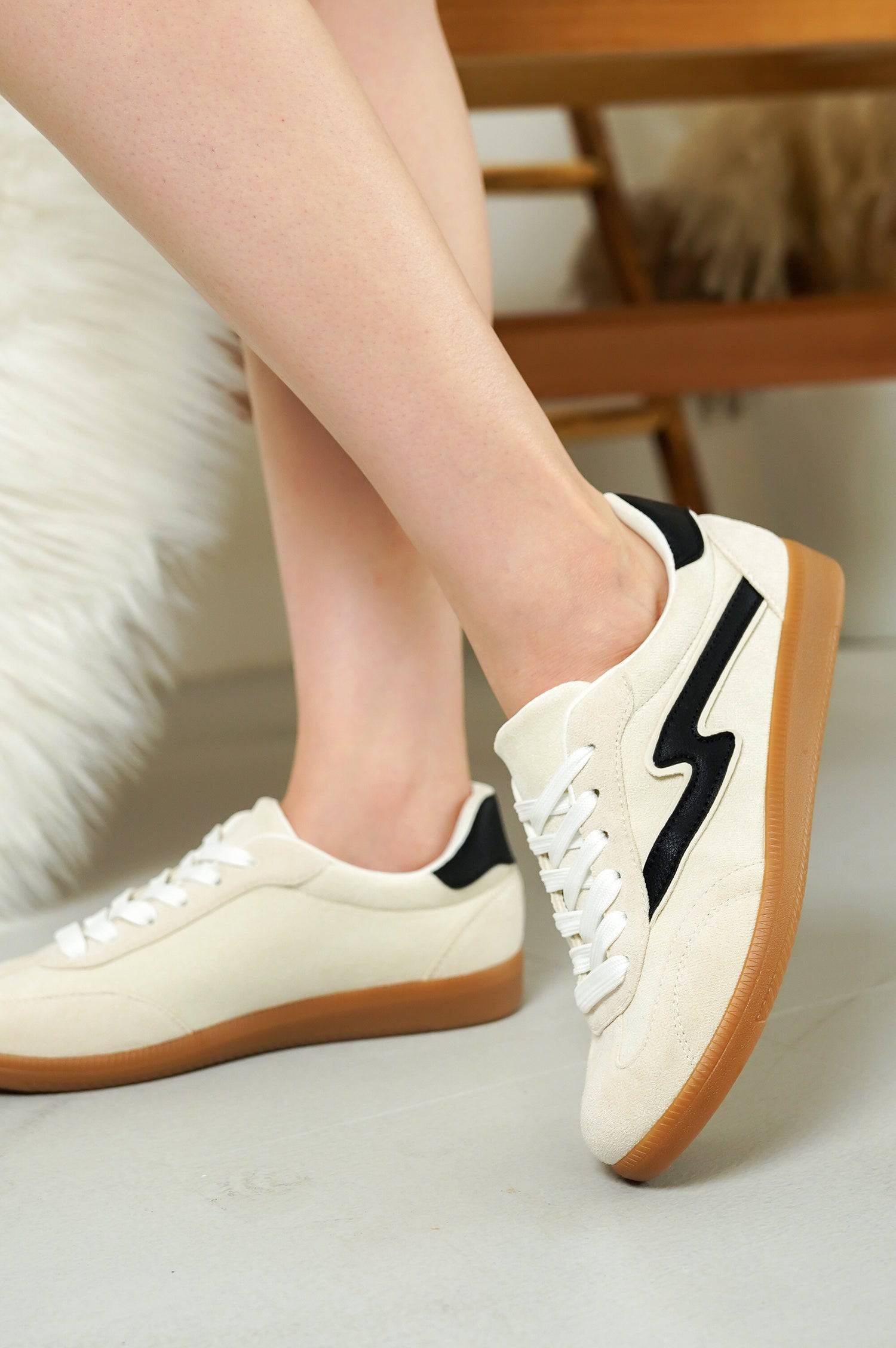 Women's cream suede Irita sneakers with lightning bolt detail, brown sole, lace-up style.