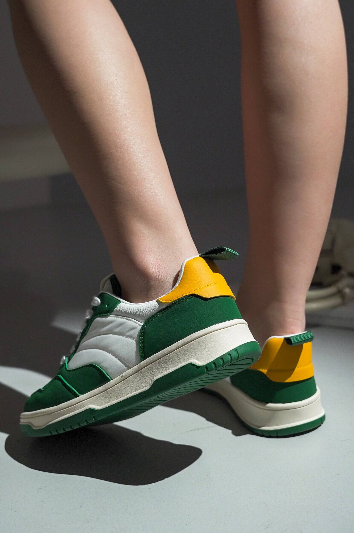 Green, yellow, and white vegan leather Kiki sneakers. Comfortable, stylish women's fashion sneakers.
