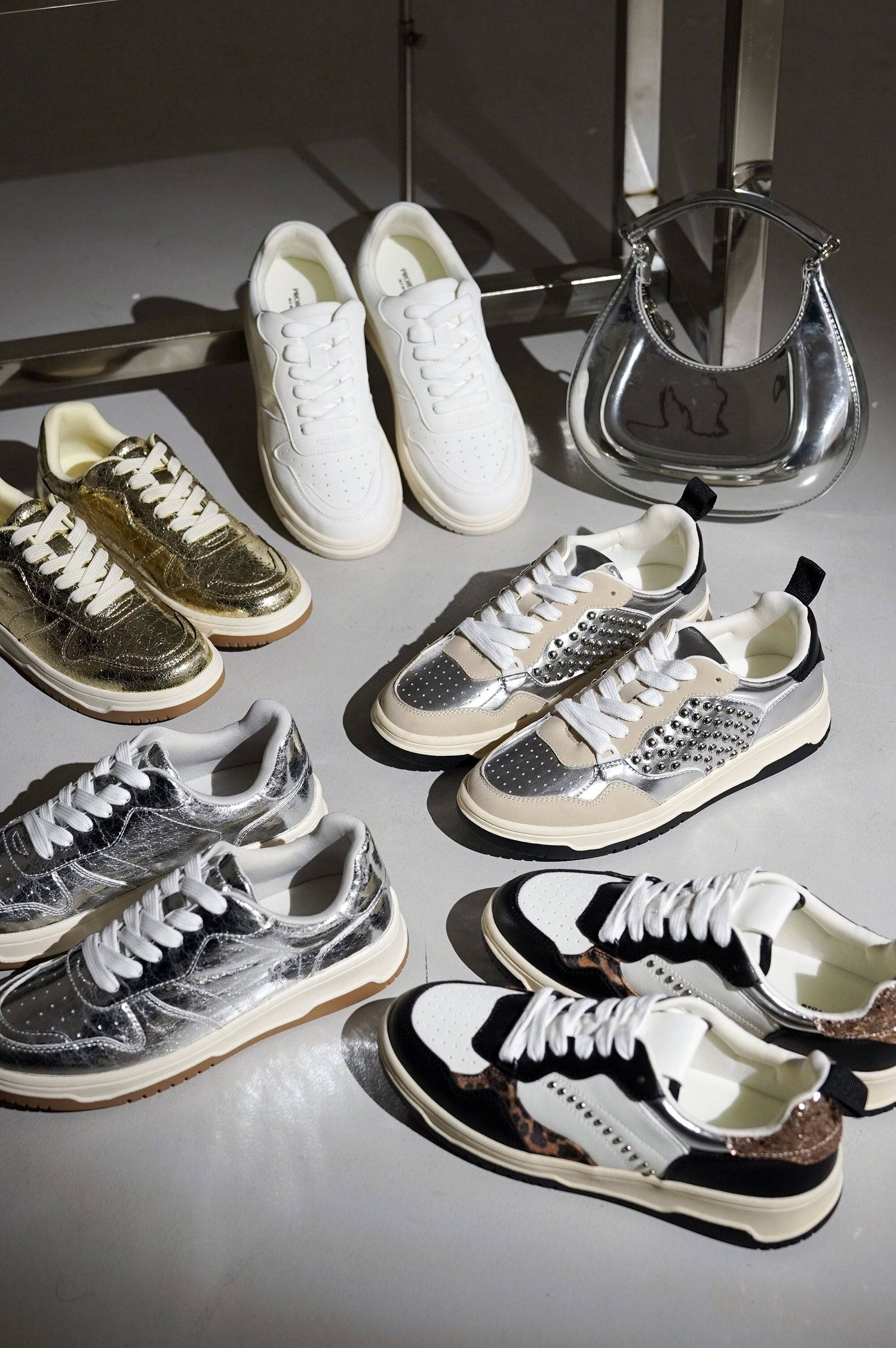Women's sneakers in multiple styles: vegan leather, metallic, leopard print, memory foam.