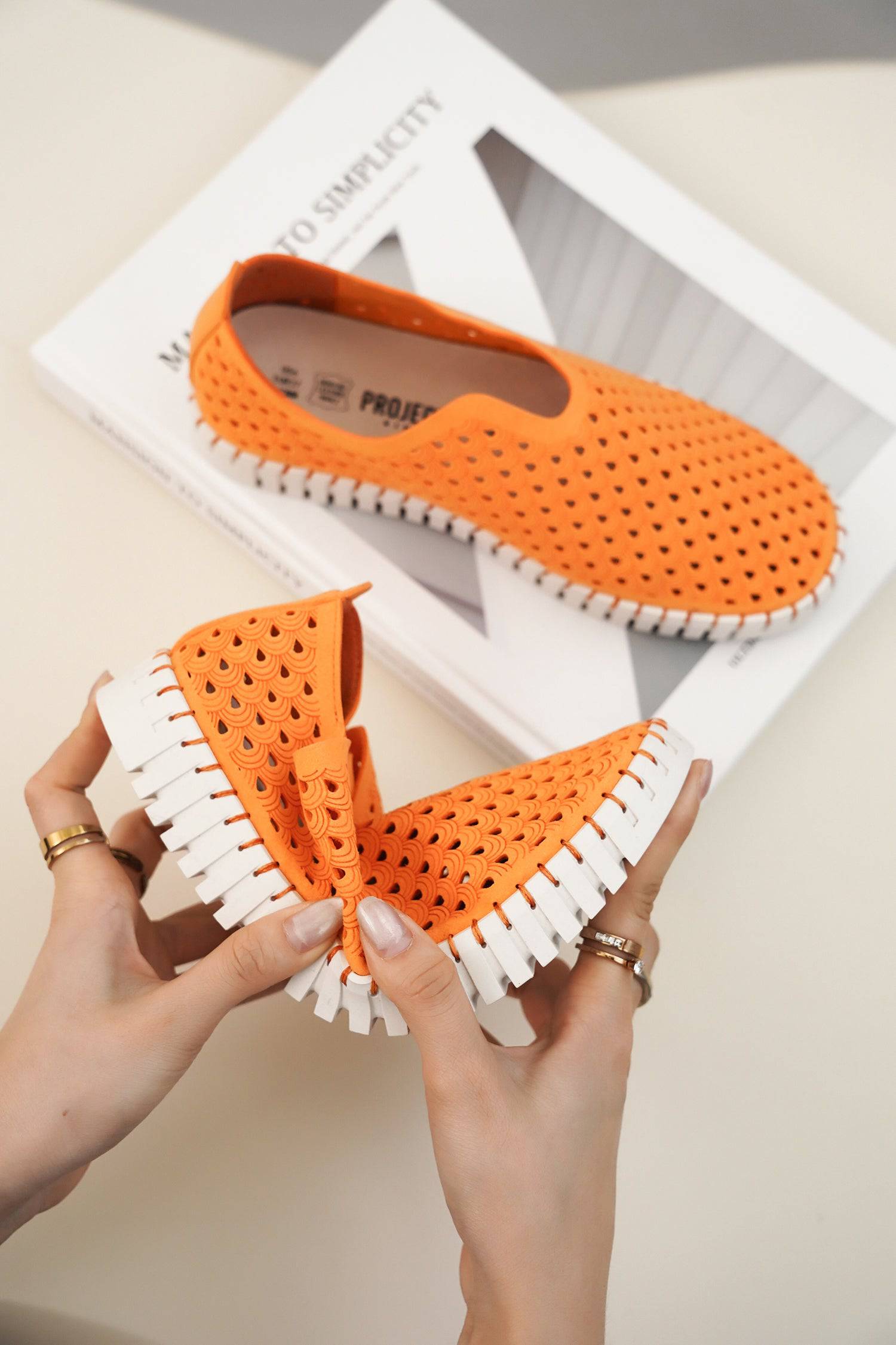 Orange women's slip-on loafers, perforated design, white sole. Lightweight flats. Project Cloud comfort shoes.