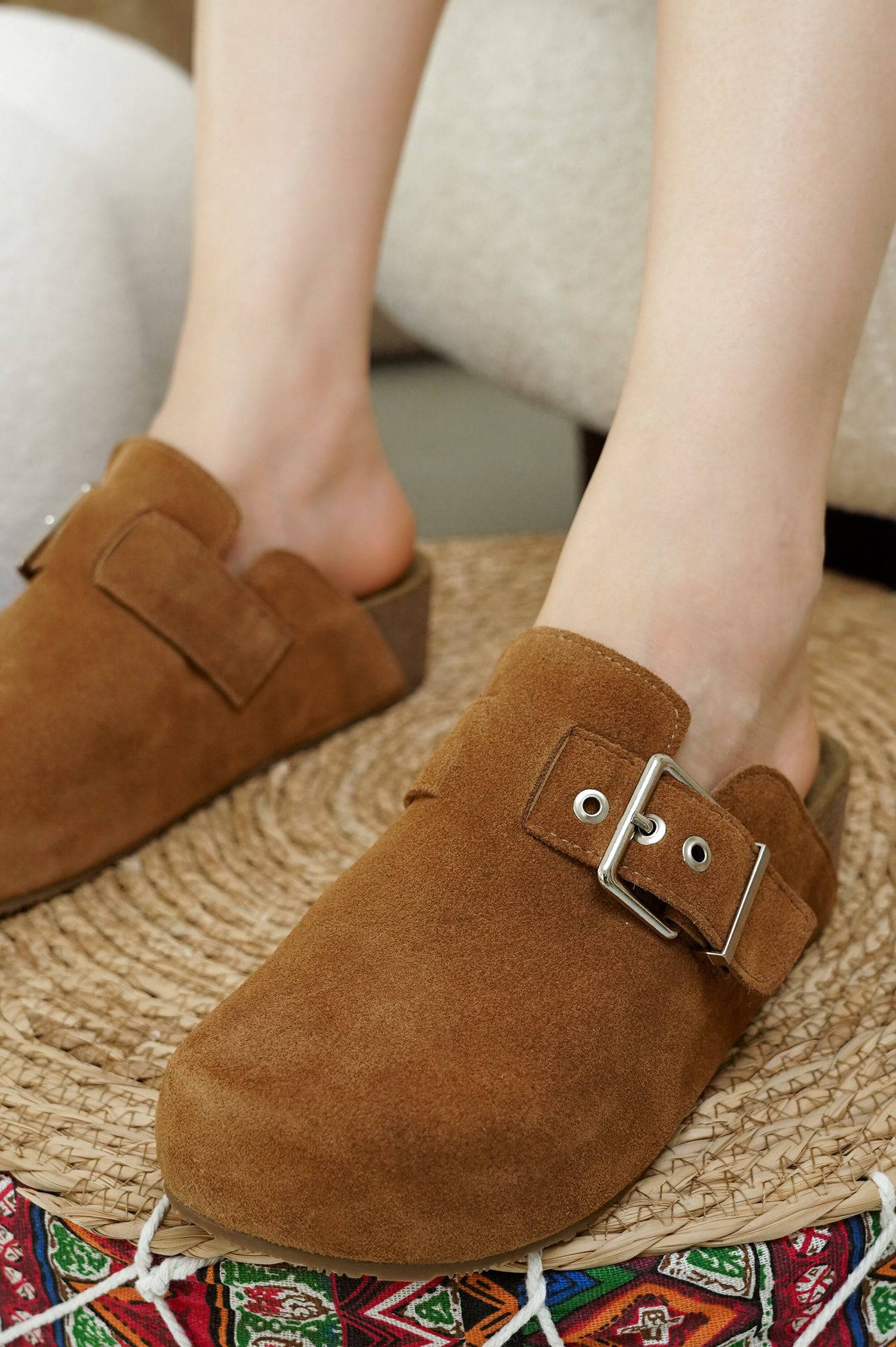 Project Cloud Rhona Clogs in Brown Suede. Adjustable buckle, memory foam footbed, on a woven mat.