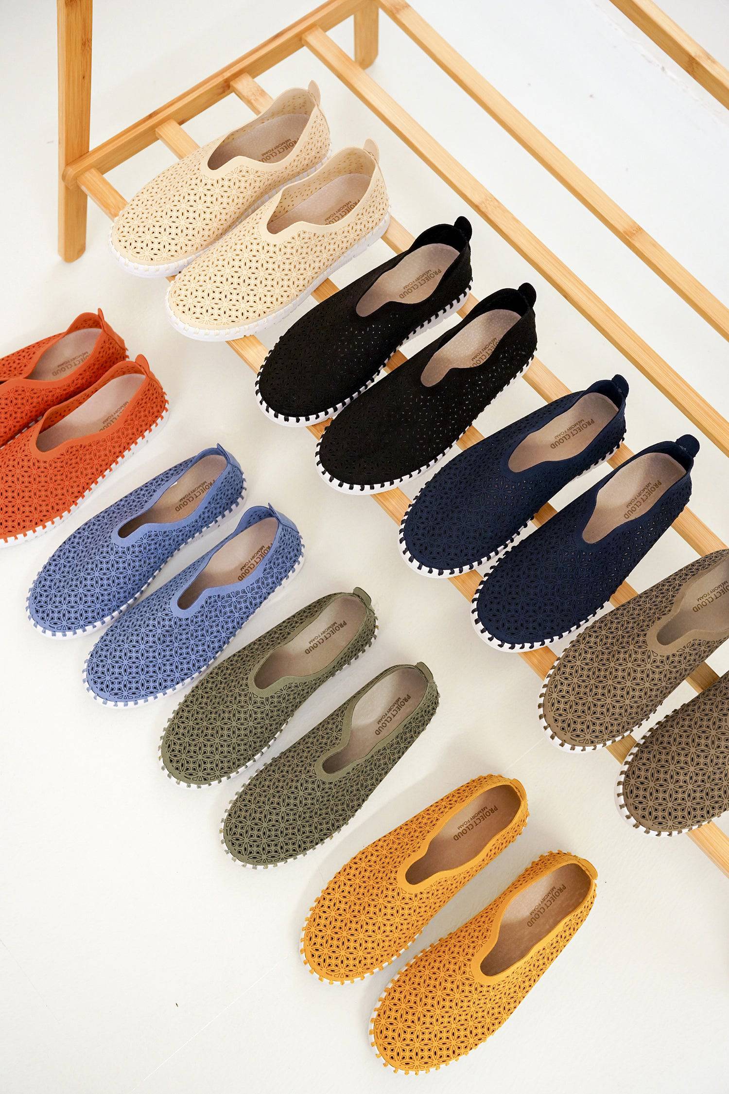 Project Cloud Rose sneakers: Lightweight slip-ons for women. Laser-cut design, memory foam, various colors.