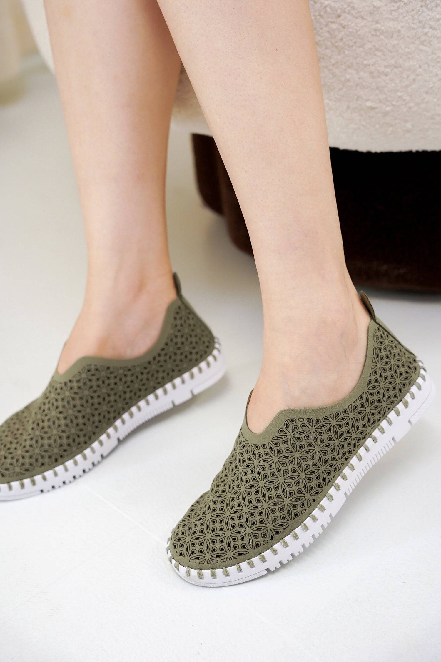 Olive green laser-cut slip-on sneakers for women, Project Cloud's comfortable design with memory foam.
