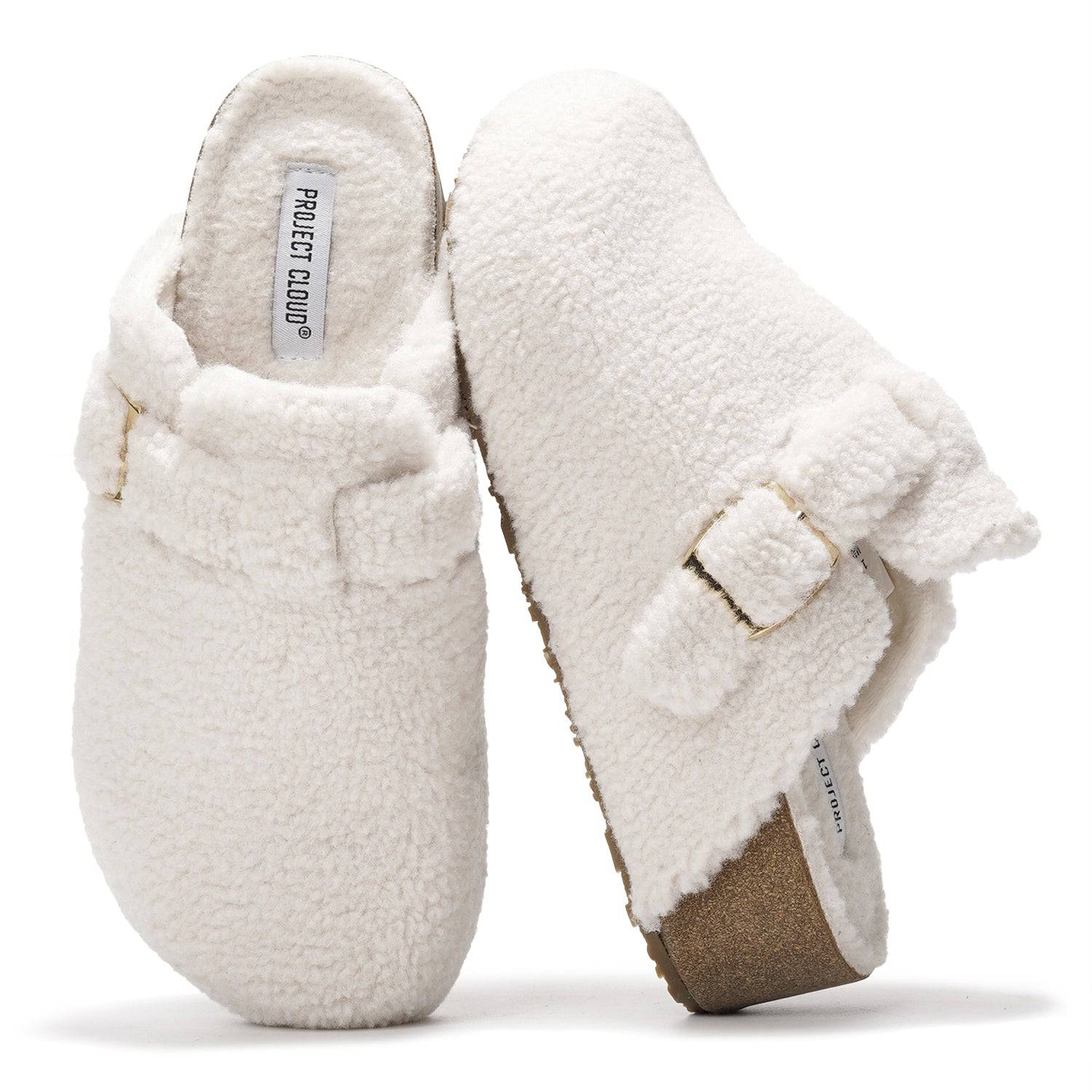 Women's Rhona Clogs in White.  Featuring faux shearling, adjustable buckle, and Project Cloud logo.  Memory foam clogs.