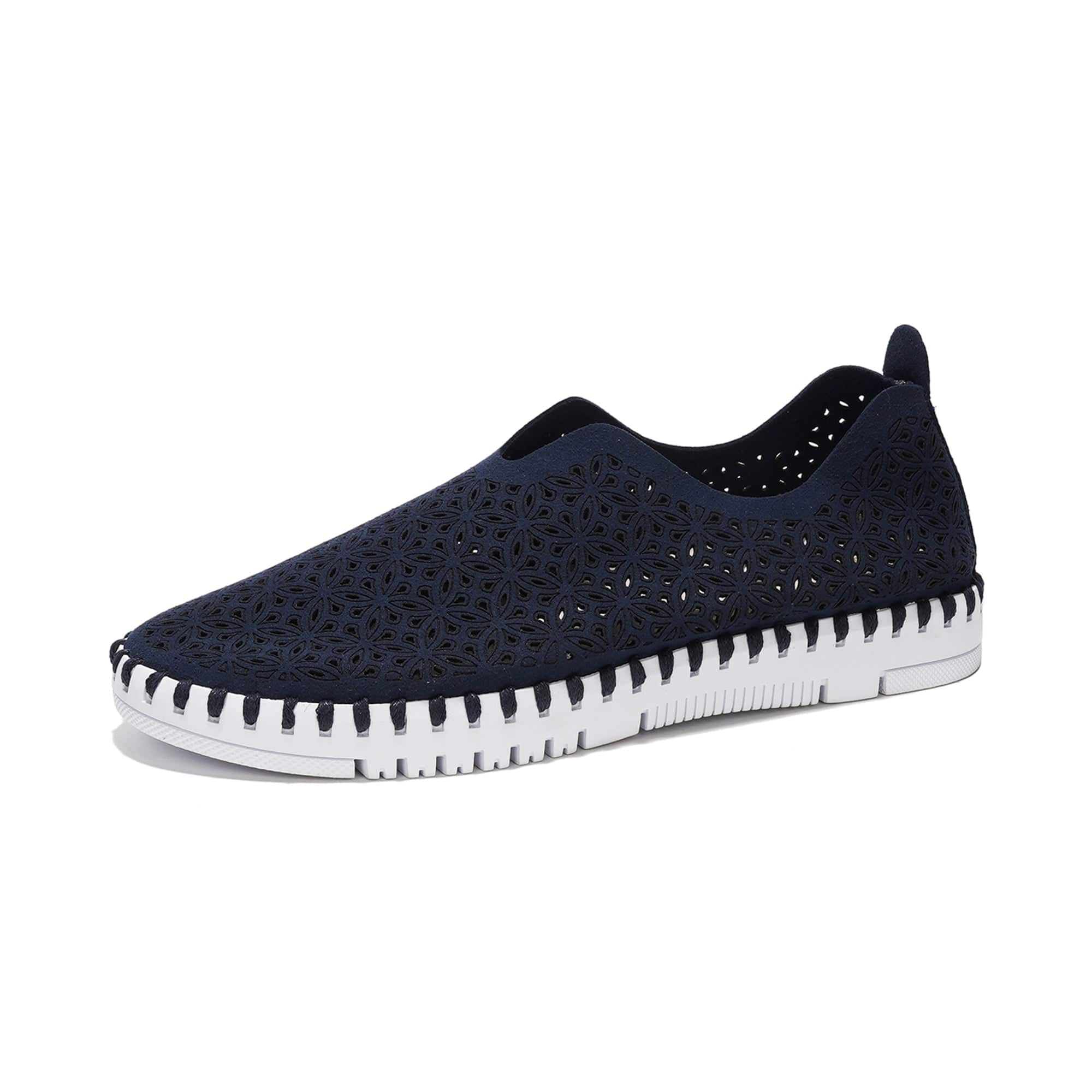 Navy blue laser-cut slip-on sneakers for women. Project Cloud's lightweight design, comfortable fit, and memory foam insole.