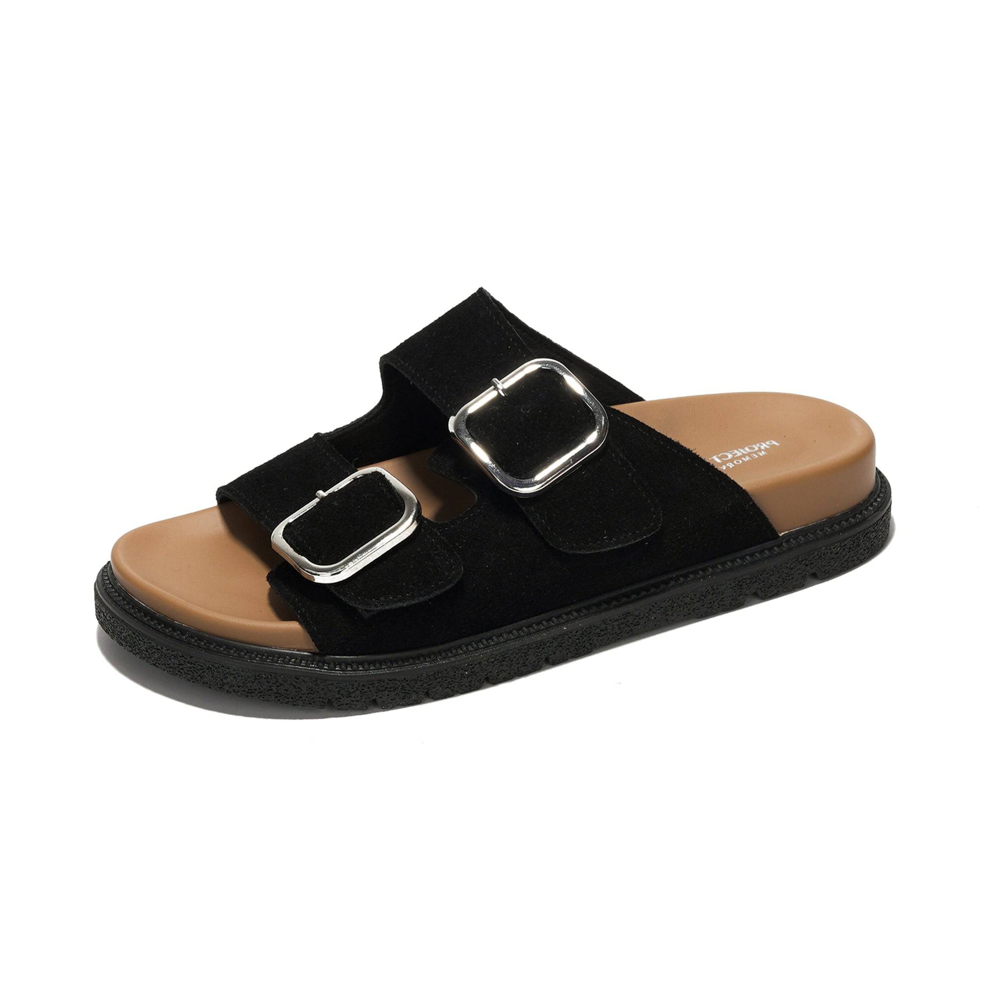 Black suede leather platform slides with silver buckles and natural cork footbed for women.