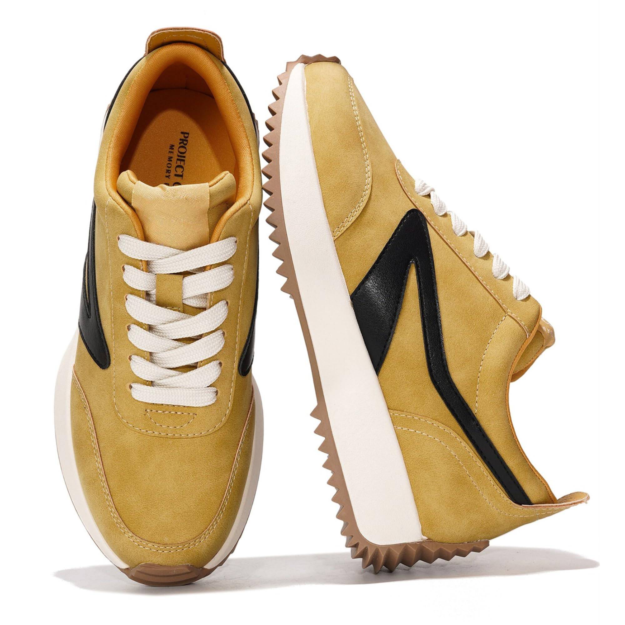 Balinda women's sneakers in mustard yellow with Project Memory Foam, lace-up closure, and a black accent.